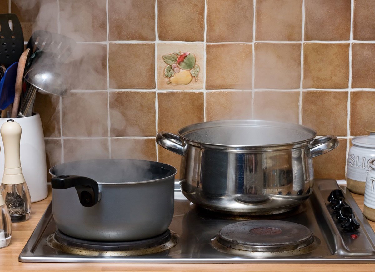 An image of some pans on a hob bubbling away